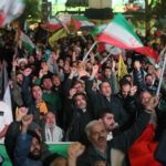People holding Iranian, Palestinian and pro-IRGC flags gather to stage a demonstration in support of Iran's attack on Israel in Tehran, Iran on April 14.